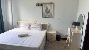 Ένα ή περισσότερα κρεβάτια σε δωμάτιο στο Masaki H and Apartment +12 φωτογραφίες