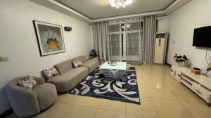 Χώρος καθιστικού στο Masaki H and Apartment