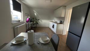 Kuchyň nebo kuchyňský kout v ubytování Modernes Apartment Schwarzenfeld + 18 fotografií