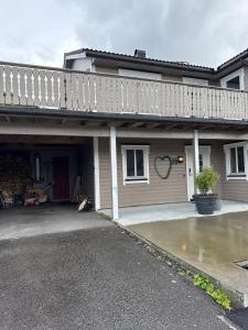 a house with a driveway in front of it at Townhouse with 4 bedrooms near Sørstrand 