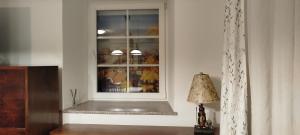 a window in a room with a table and a lamp at Statek Kloubek in Chabičovice +186 photos