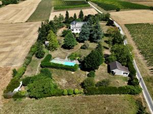 an aerial view of a house with a green train at Maison la grande serre in Blaslay