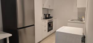 Kuchyň nebo kuchyňský kout v ubytování Habito Luxury Apartment - Breakbooking CY