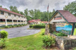 a building with a sign that reads hotel at Hofbrau Riverfront Hotel in Helen