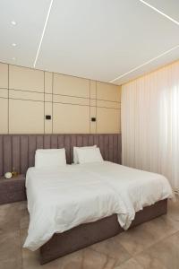 Ένα ή περισσότερα κρεβάτια σε δωμάτιο στο וילת כוכב "נופש בכנרת"