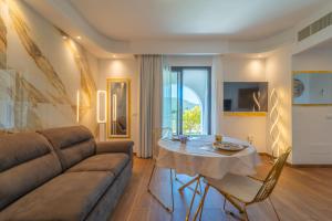 a living room with a couch and a table at Dream house in Olbia