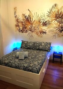 a bedroom with a bed with two pillows on it at Noblerot in Turin