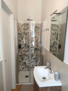 a bathroom with a shower and a sink at Noblerot in Turin