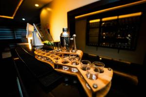 a group of glasses on a table in a bar at Ralphnest Suite & Lounge Limited in Otta