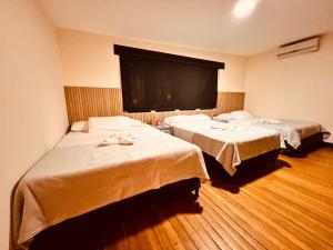 Ένα ή περισσότερα κρεβάτια σε δωμάτιο στο Hotel villa aloha