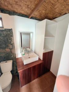 a bathroom with a sink and a toilet at Casa Praia Tarrafal de Monte Trigo in Seladinha +36 photos