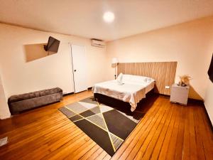 Ένα ή περισσότερα κρεβάτια σε δωμάτιο στο Hotel villa aloha