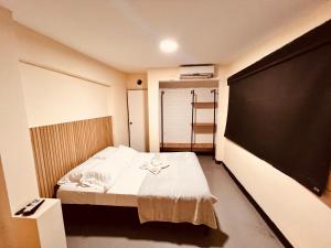 Ένα ή περισσότερα κρεβάτια σε δωμάτιο στο Hotel villa aloha