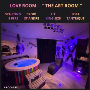 a room with a jacuzzi tub in the middle at LoveroomL1TIMISTE TAR in La Rochelle
