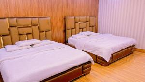 Ένα ή περισσότερα κρεβάτια σε δωμάτιο στο Sapphire Suits & Boutique Hotel