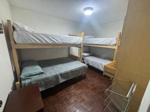 a room with two bunk beds in a room at Hostel Wayra Wasi in Lima