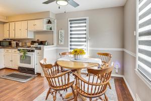 a kitchen and dining room with a table and chairs at Cozy Home 4 Mi to YSU Campus Penguins Welcome! in Boardman