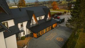 an overhead view of a house with a black roof at Willa Paula in Ząb +178 photos