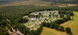 an aerial view of a park with a lot of cars at Camping Noetselerberg - Sallandse Stee - Stacaravan 5pers in Nijverdal
