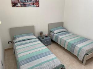 En eller flere senge i et værelse på La casa di Lina 2