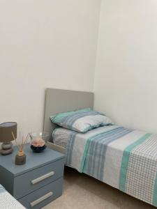 En eller flere senge i et værelse på La casa di Lina 2