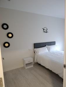 Postel nebo postele na pokoji v ubytování Apartamentos Turísticos Praia dos Crsitais