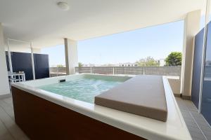 a large bath tub sitting on top of a building at Marisabella Suite Spa 2 in Bari