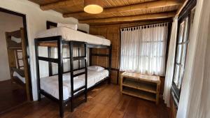 a room with two bunk beds and a window at Casitas en Vichayito, a Pasos de la Playa in Los Órganos +31 photos
