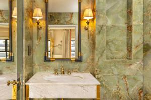 a bathroom with a sink and a mirror at The Serangoon House Little India, Singapore, a Tribute Portfolio Hotel in Singapore
