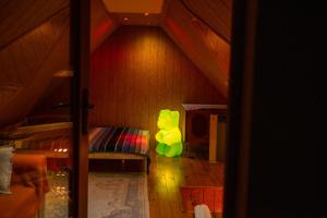 a room with a bed in the corner of a room at Wood House w Kotlinie Kłodzkiej in Kłodzko