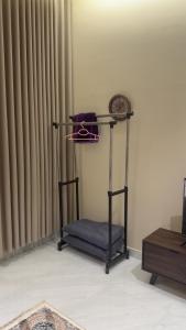 a chair sitting in a room next to a window at شقة مفروشة in Jazan