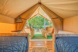 a bedroom in a tent with two beds at Nature Retreat Cozy tentHVACSpa Bath in Newport