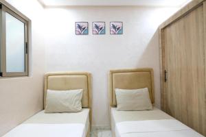 Postel nebo postele na pokoji v ubytování Riad Bollywood- International