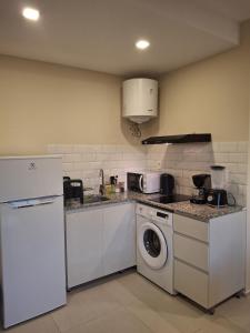 Kuchyň nebo kuchyňský kout v ubytování Dpto Resort zona aeropuerto