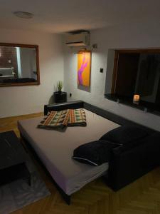 a large bed in a room with at TRUTH Apartment Veles in Veles