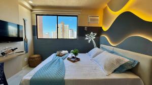 Ένα ή περισσότερα κρεβάτια σε δωμάτιο στο (507) Studio tropical Perto da Praia