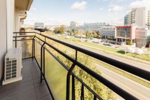 a balcony with a view of a city at BNB Sklenarova Apartment with Balcony in Trnávka