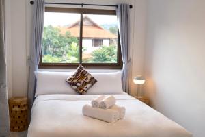 Postel nebo postele na pokoji v ubytování Little Sand Fisherman's Village