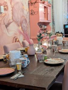 a table with plates of food on top of it at Hotel B&B LeLa in Valkenburg