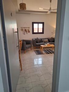 a living room with a couch and a table at Christmas Arabic Escape Roof Terrace 3 Bedroom Luxury Appartment Superb Location and just 15 mins from El Gouna in Hurghada