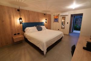 a bedroom with a bed with a hat on it at GUAJIRA CASA DEL MAR in Ríohacha +63 photos