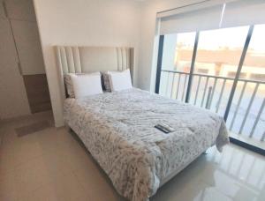 Ένα ή περισσότερα κρεβάτια σε δωμάτιο στο Oceanview Apartment in Huanchaco