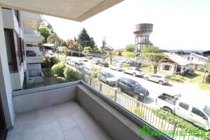 a balcony with a view of a parking lot at MPH 204 Departamento en Puerto Varas a pasos del Lago, para 6 personas in Puerto Varas