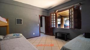 Ένα ή περισσότερα κρεβάτια σε δωμάτιο στο Casa em Aquiraz com Piscina 10 min do Beach Park