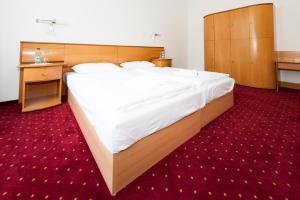 Ein Bett oder Betten in einem Zimmer der Unterkunft Seminarhaus Europäische Akademie