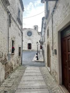 an empty alley with a building in the background at Ad un Passo dal Duomo in Bovino
