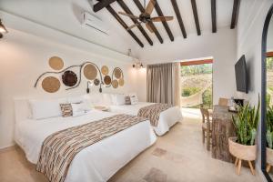 Ένα ή περισσότερα κρεβάτια σε δωμάτιο στο Fina Estampa Country Hotel by HMC - Mayores de 10 años - +70 φωτογραφίες