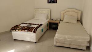 Ένα ή περισσότερα κρεβάτια σε δωμάτιο στο BaitAlhoor GardenHostel