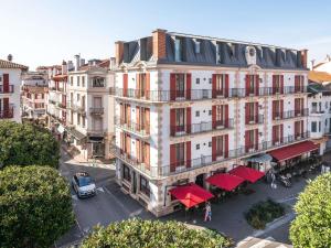 an overhead view of a building with red awnings at MADISON Saint Jean de Luz - Handwritten Collection in Saint-Jean-de-Luz