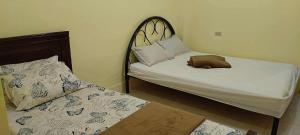 Postel nebo postele na pokoji v ubytování Raya's Guesthouse Rainy Day Promo- No Downpayment Needed